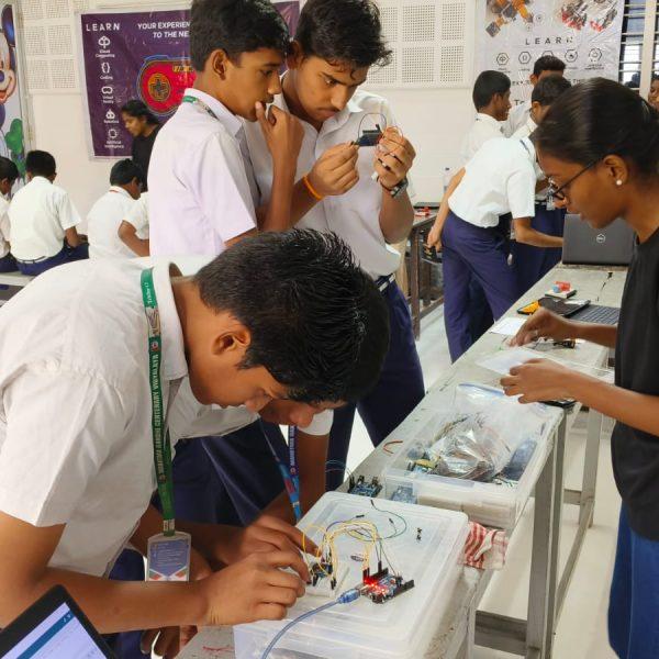 Students working together on a hands-on technology project