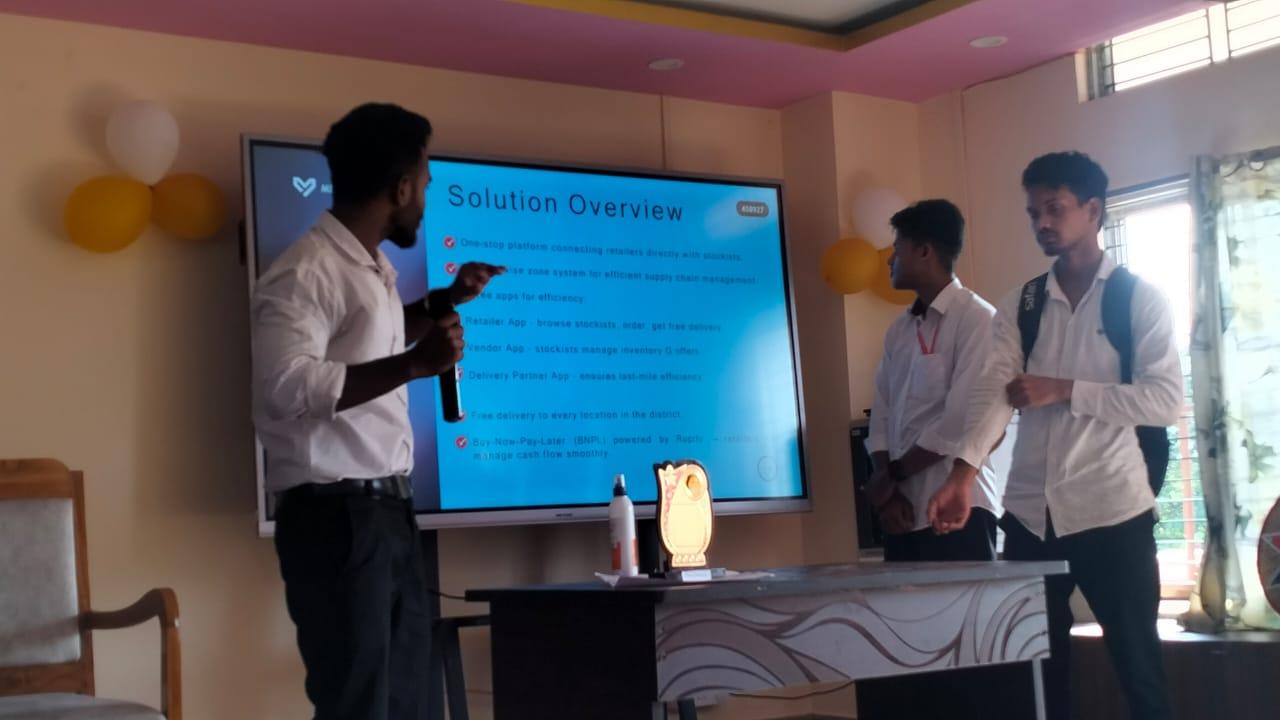 Students presenting a business solution to an audience